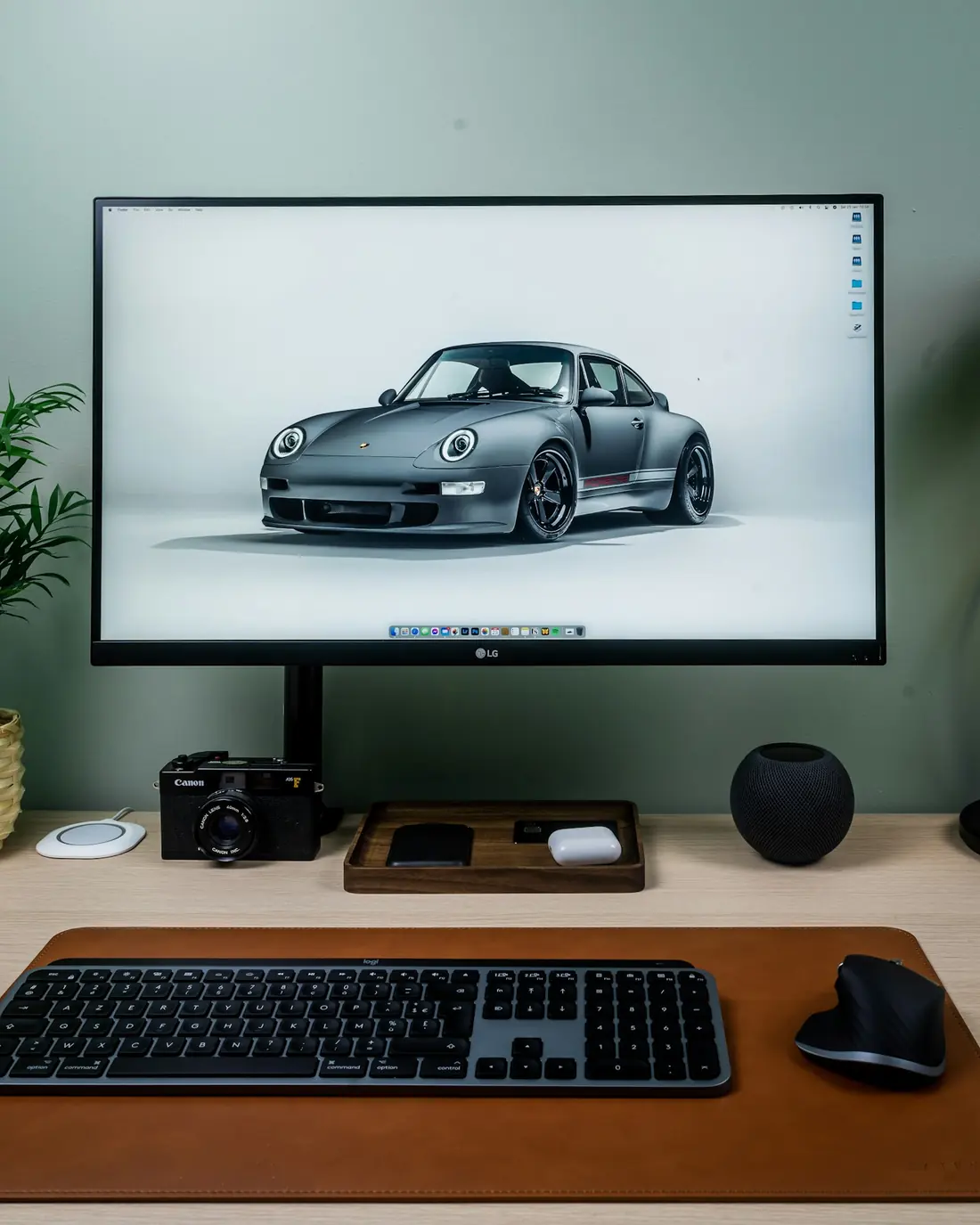 A desktop monitor on a clean wooden desk